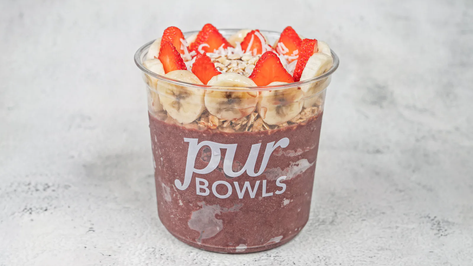 Amazon Bowl with acai, banana, strawberries, coconut, granola, and almonds