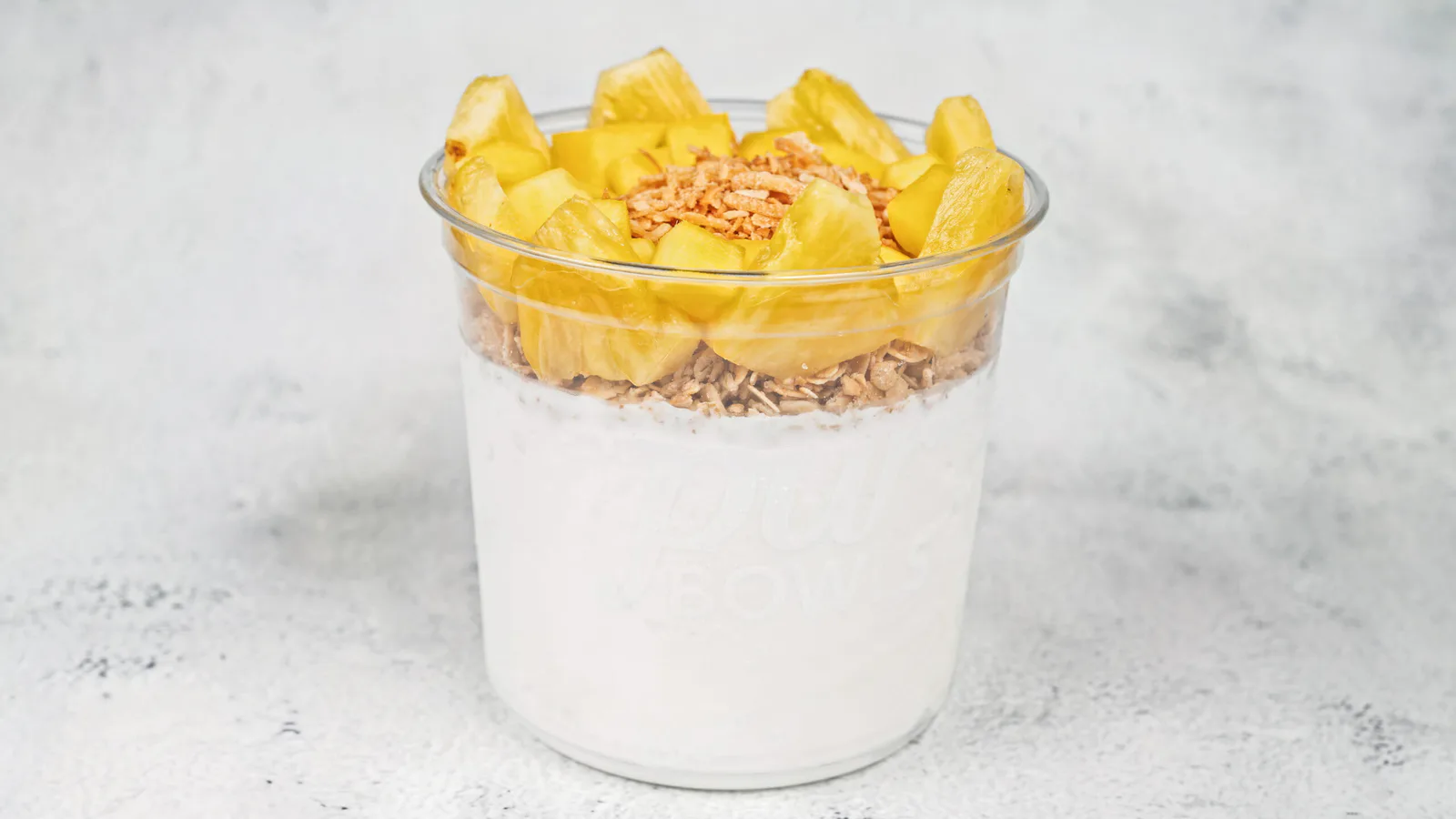 Island Bowl with coconut base, pineapple, mango, granola, and toasted coconut