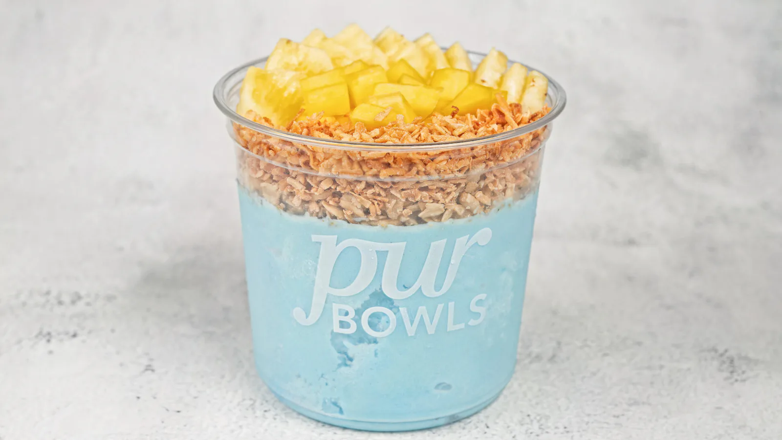 Blue Tropical Bowl with Coco Lina base, pineapple, mango, granola, and coconut